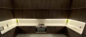 Modular kitchen with cabinets and built in oven