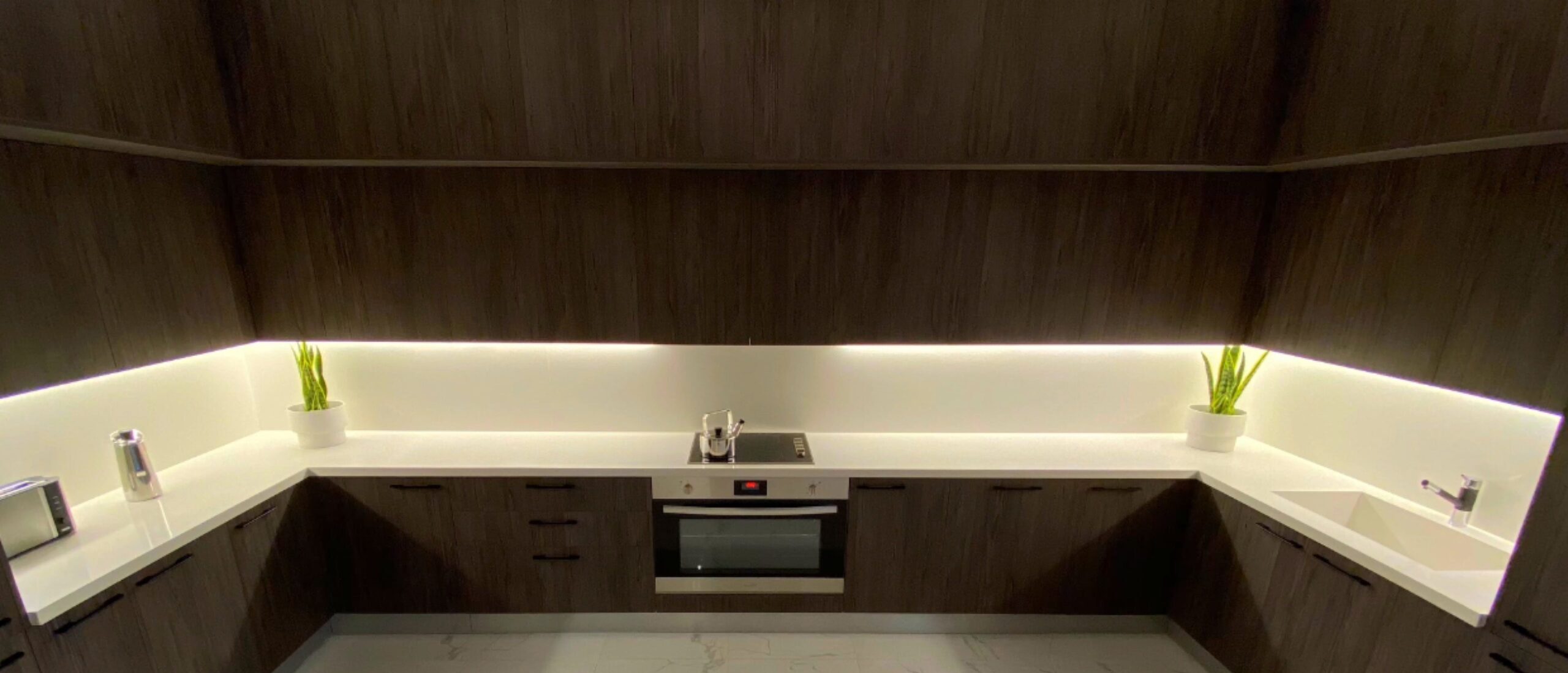 Modular kitchen with cabinets and built in oven
