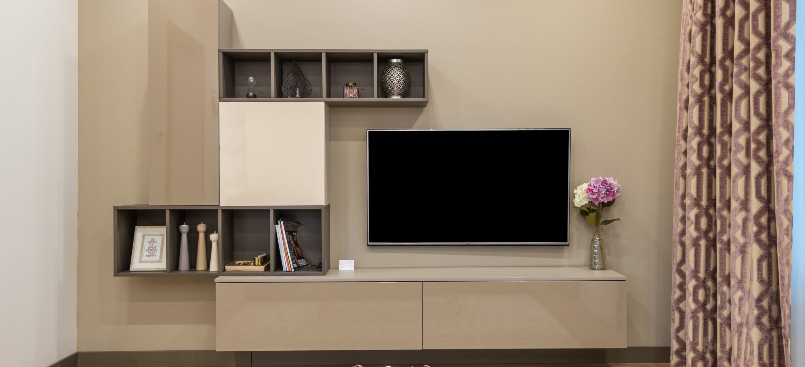 tv unit with storage drawers and vertical cabinets with hanging tv